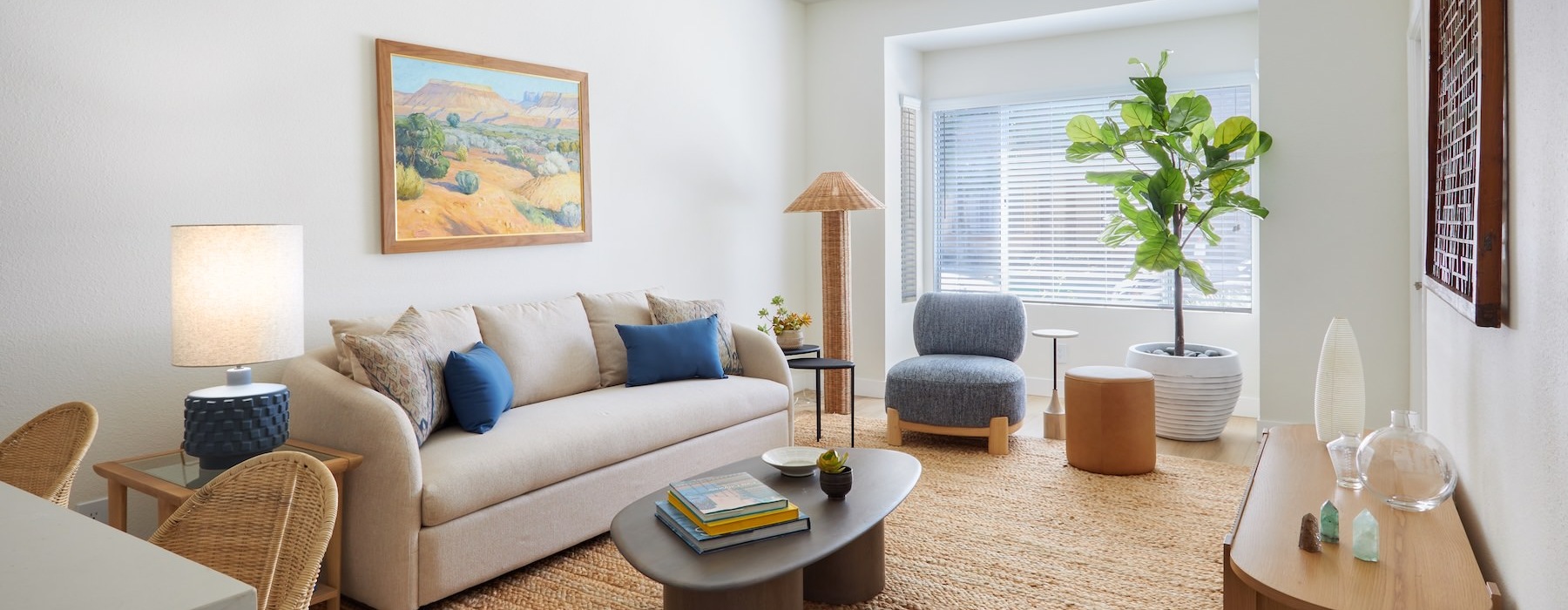 a living room with a couch and chairs