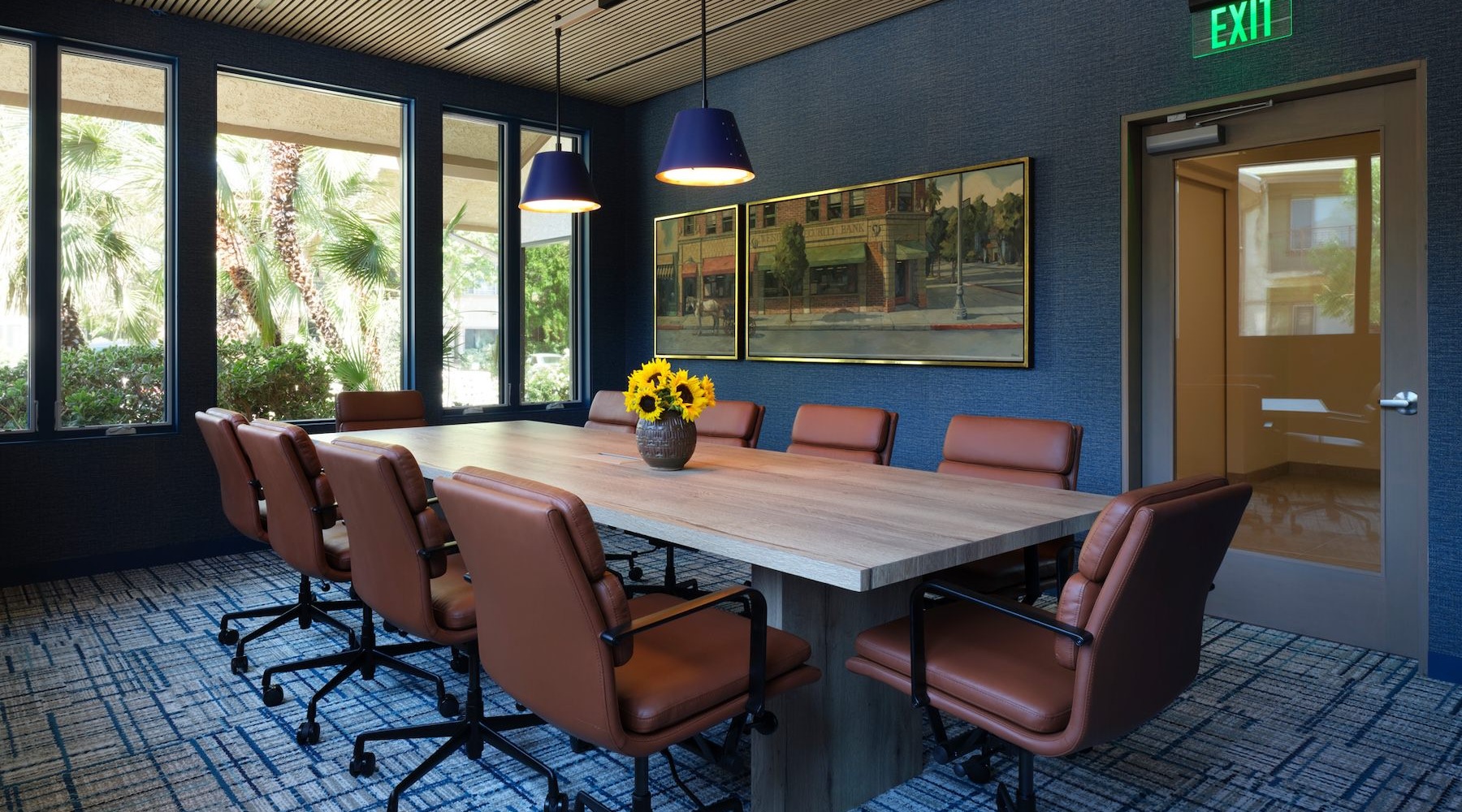 a clubroom with a table and chairs