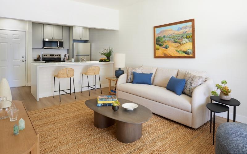 a living room with a couch and a table
